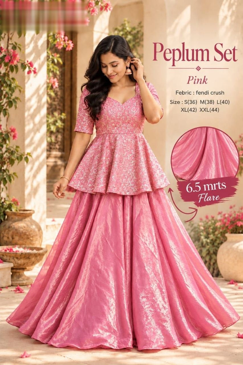 Exquisite two-piece ensemble featuring a classic peplum top paired with a gracefully flowing skirt
