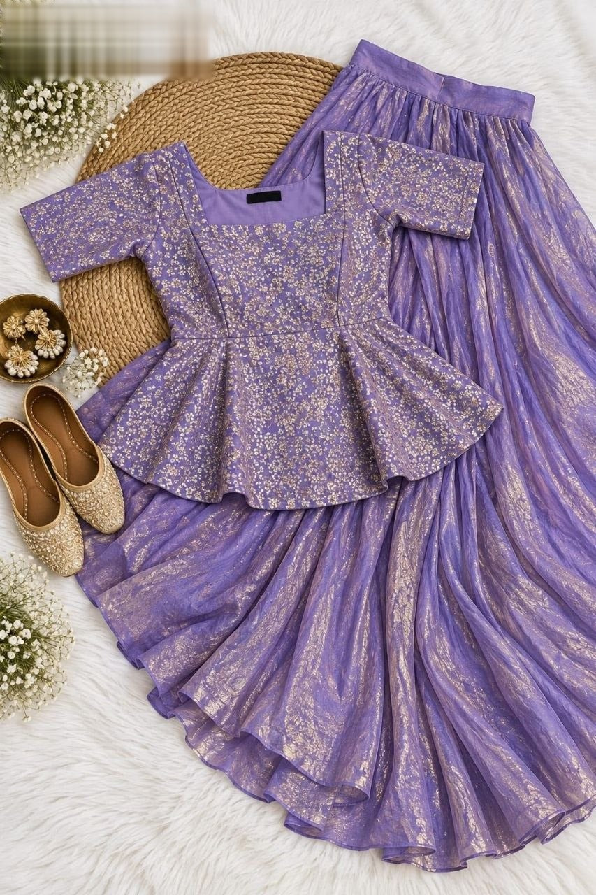 Exquisite two-piece ensemble featuring a classic peplum top paired with a gracefully flowing skirt
