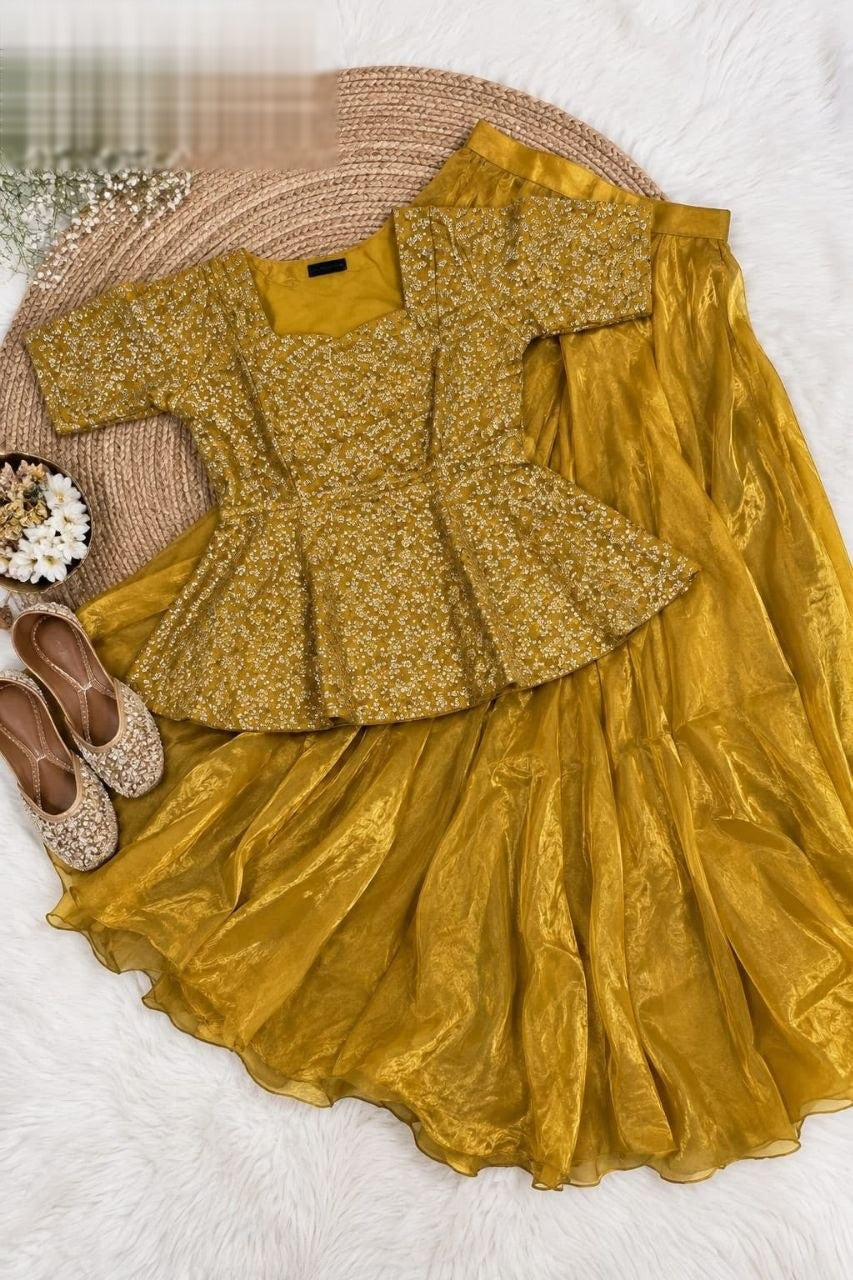 Exquisite two-piece ensemble featuring a classic peplum top paired with a gracefully flowing skirt