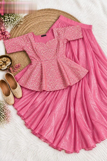 Exquisite two-piece ensemble featuring a classic peplum top paired with a gracefully flowing skirt