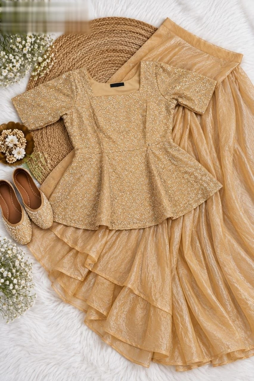 Exquisite two-piece ensemble featuring a classic peplum top paired with a gracefully flowing skirt